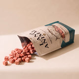 Land Animal Tuna Bites for Cats treats spilling from pouch